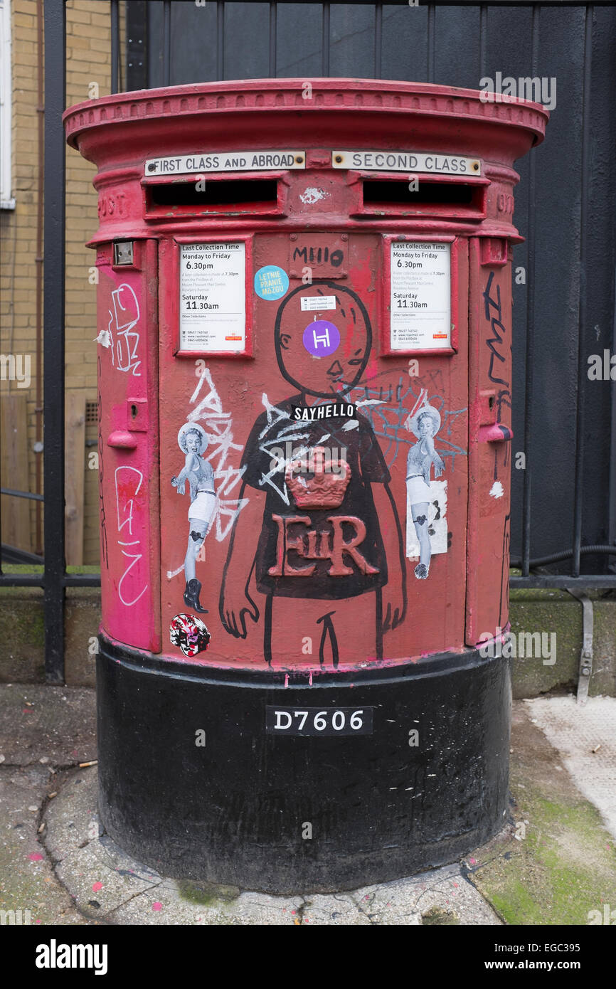 Street Art Graffiti on Royal Mail Postbox in Shoreditch Stock Photo