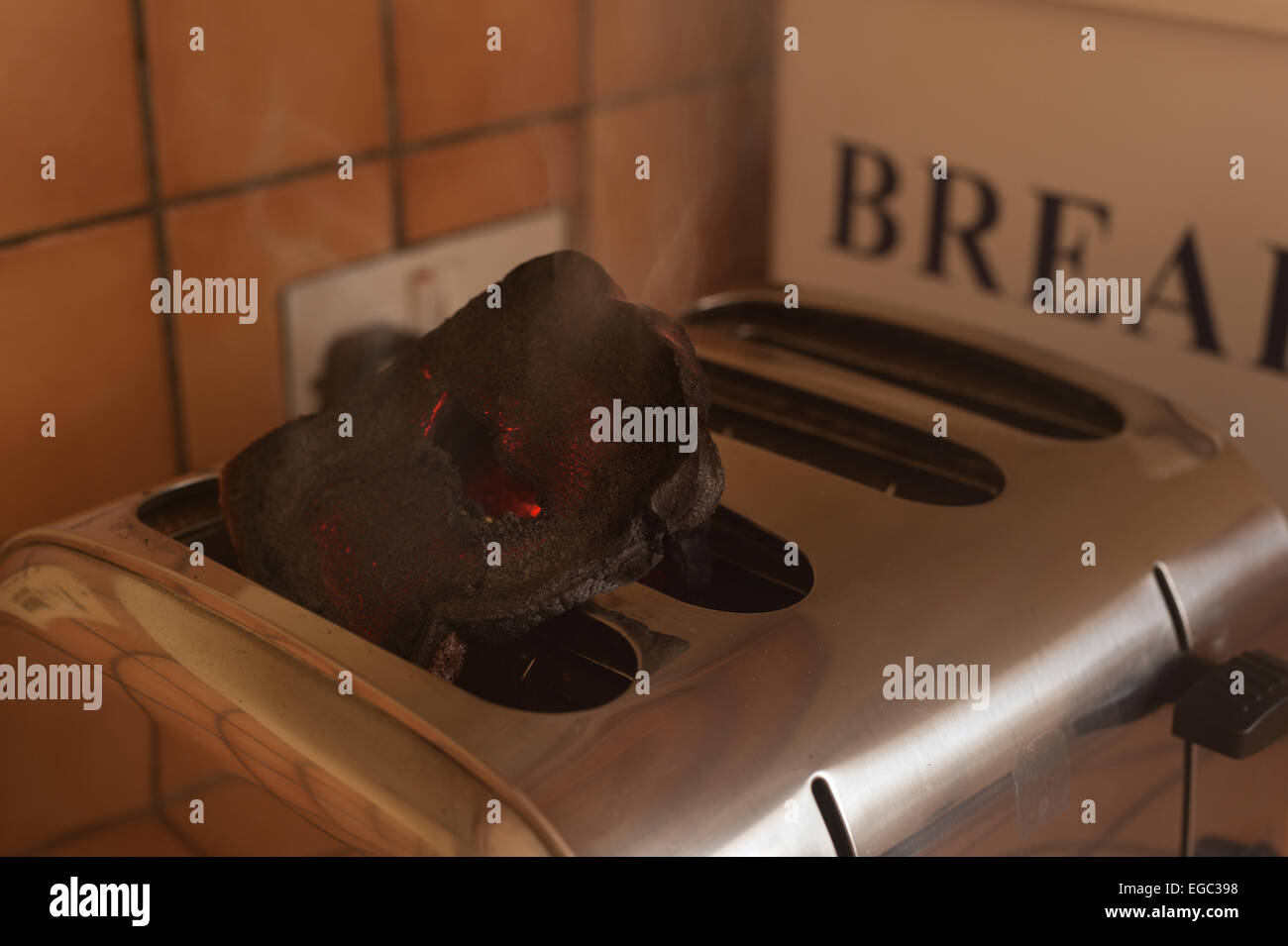 risk of fire smoking burning toast in the toaster in kitchen