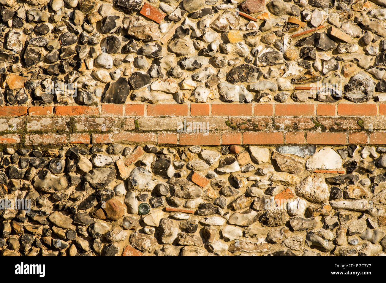 An old wall made with flint and other items readily available in the