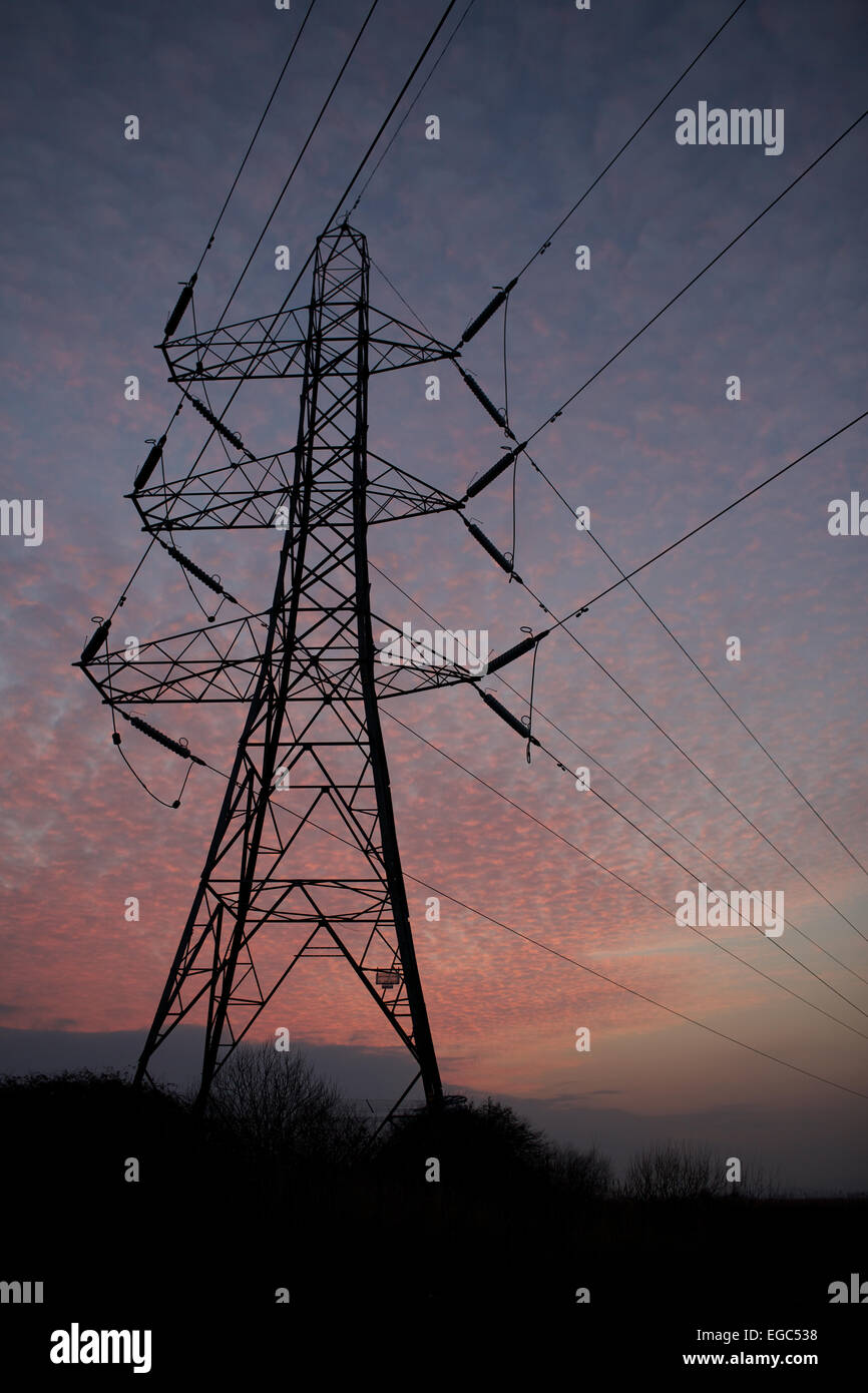 Electricity pylons and power lines, at dusk Stock Photo - Alamy