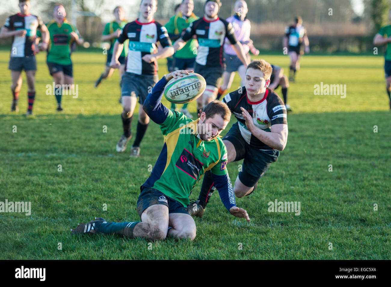 Rugby player in action running with the ball. Stock Photo