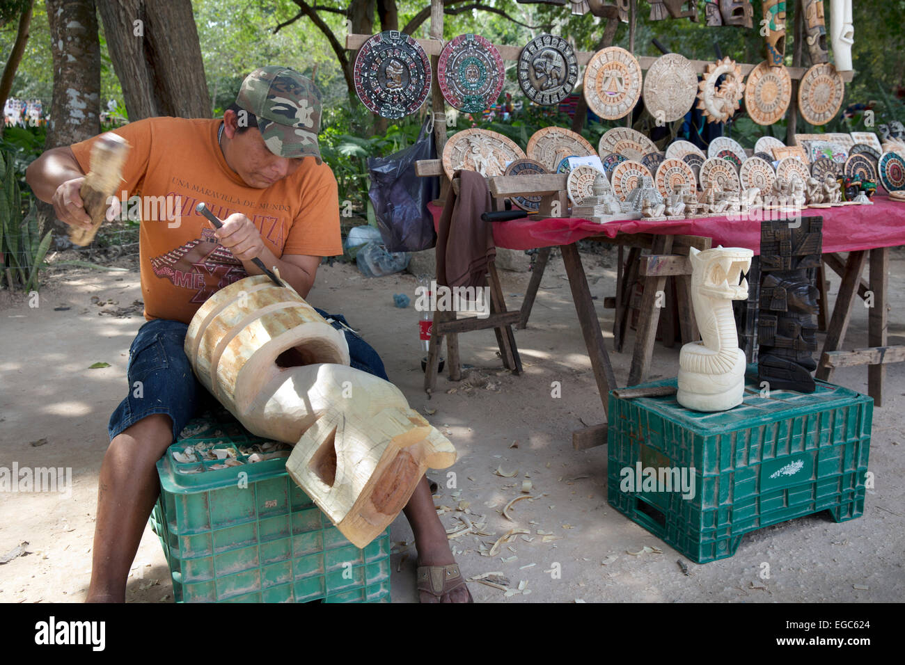 Craftsman carves tourist souvenirs, Chichen Itza, Yucatan, Mexico Stock Photo