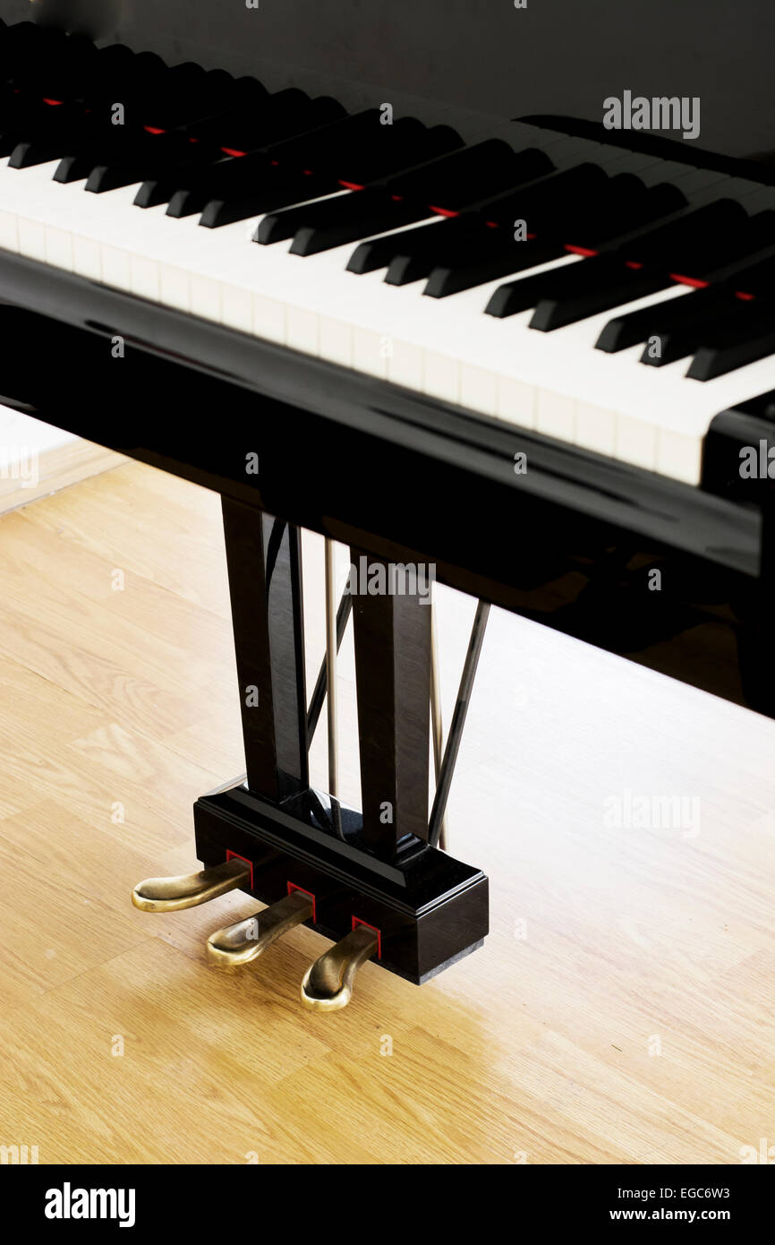 Piano pedals from an upright view at a concert hall Stock Photo