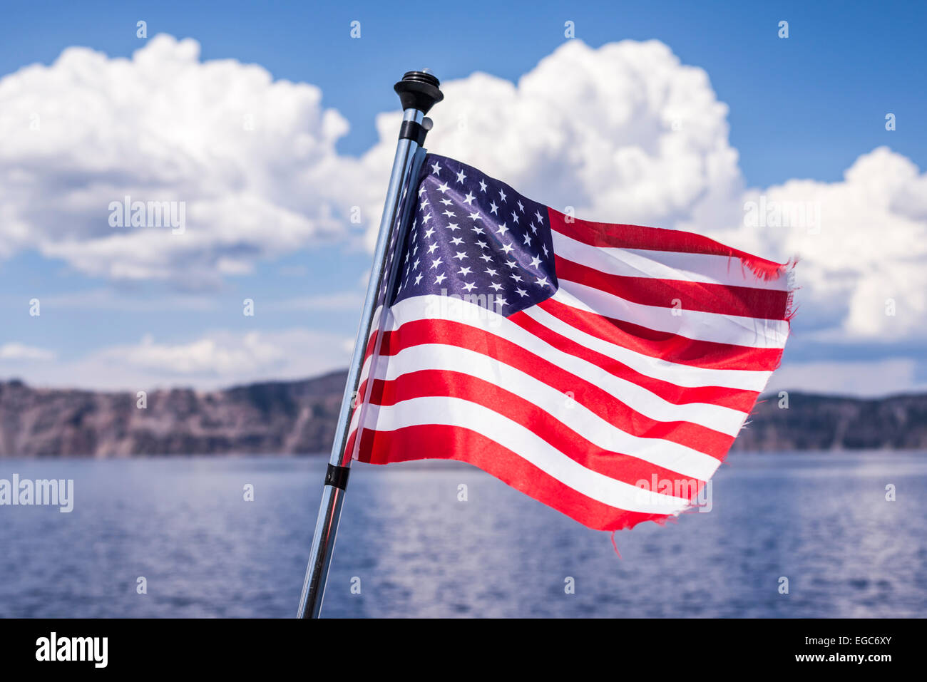 American Flag on the back of a tour boat on Crater Lake. Crater Lake National Park, Oregon, USA. Stock Photo