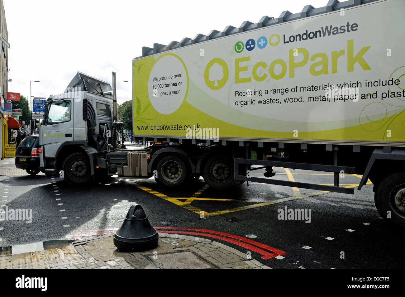 Large articulated left-turning lorry, London Waste and Eco Park on the side turning left into Drayton Park from Holloway Road Stock Photo