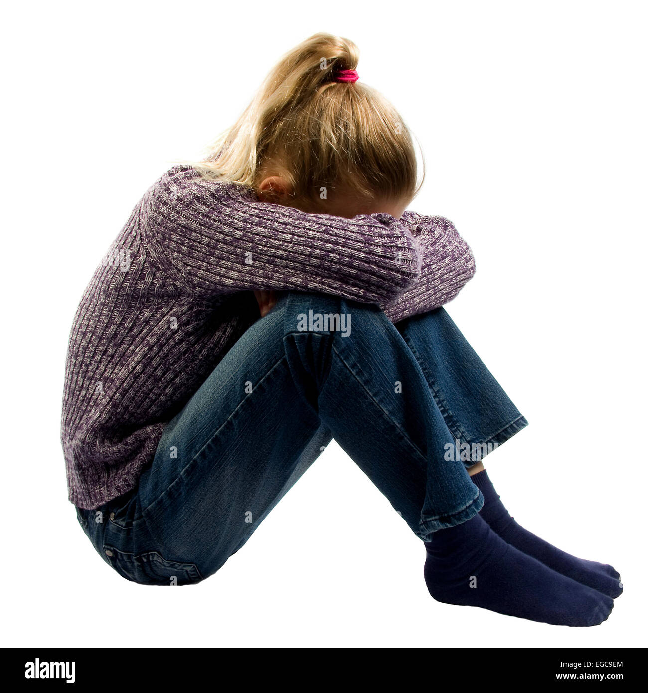 sad girl sitting on ground crying over white background Stock Photo - Alamy