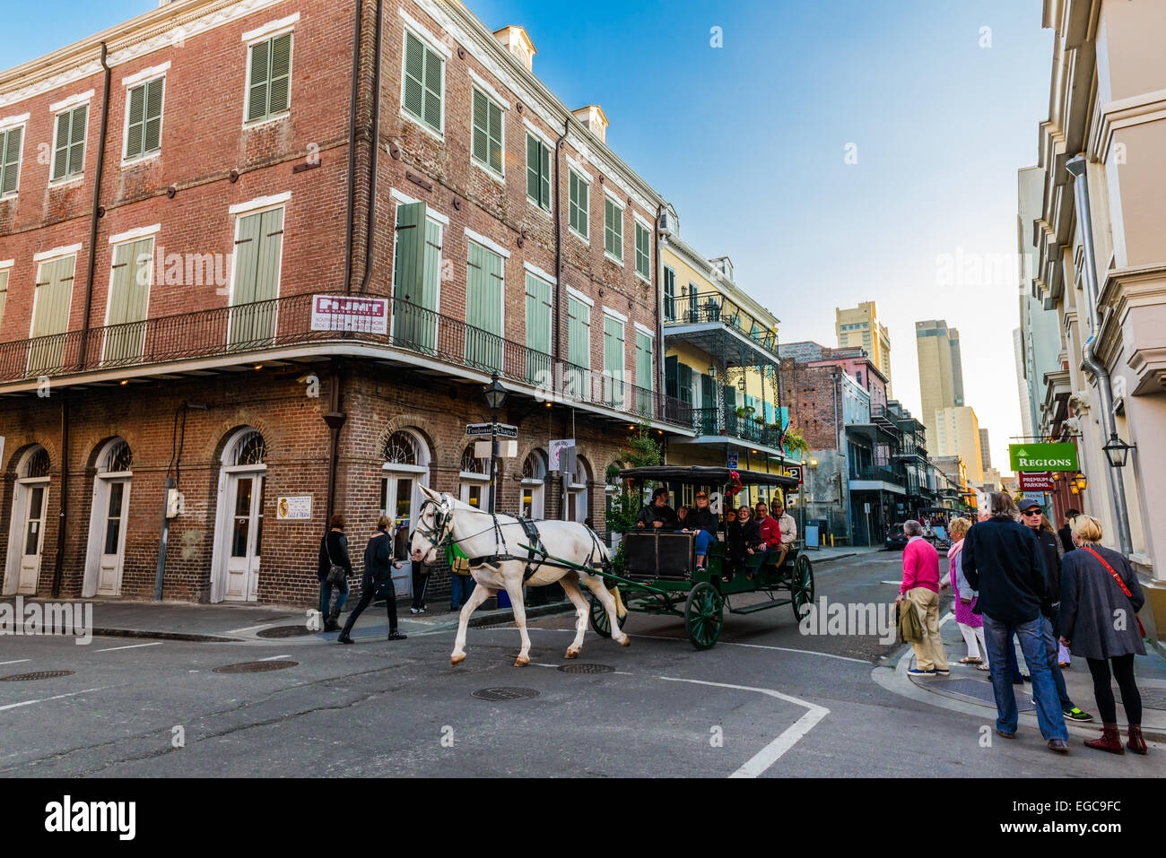 One of most popular entertainments in New Orleans - tour around French quarter in a mule-drawn carriage Stock Photo
