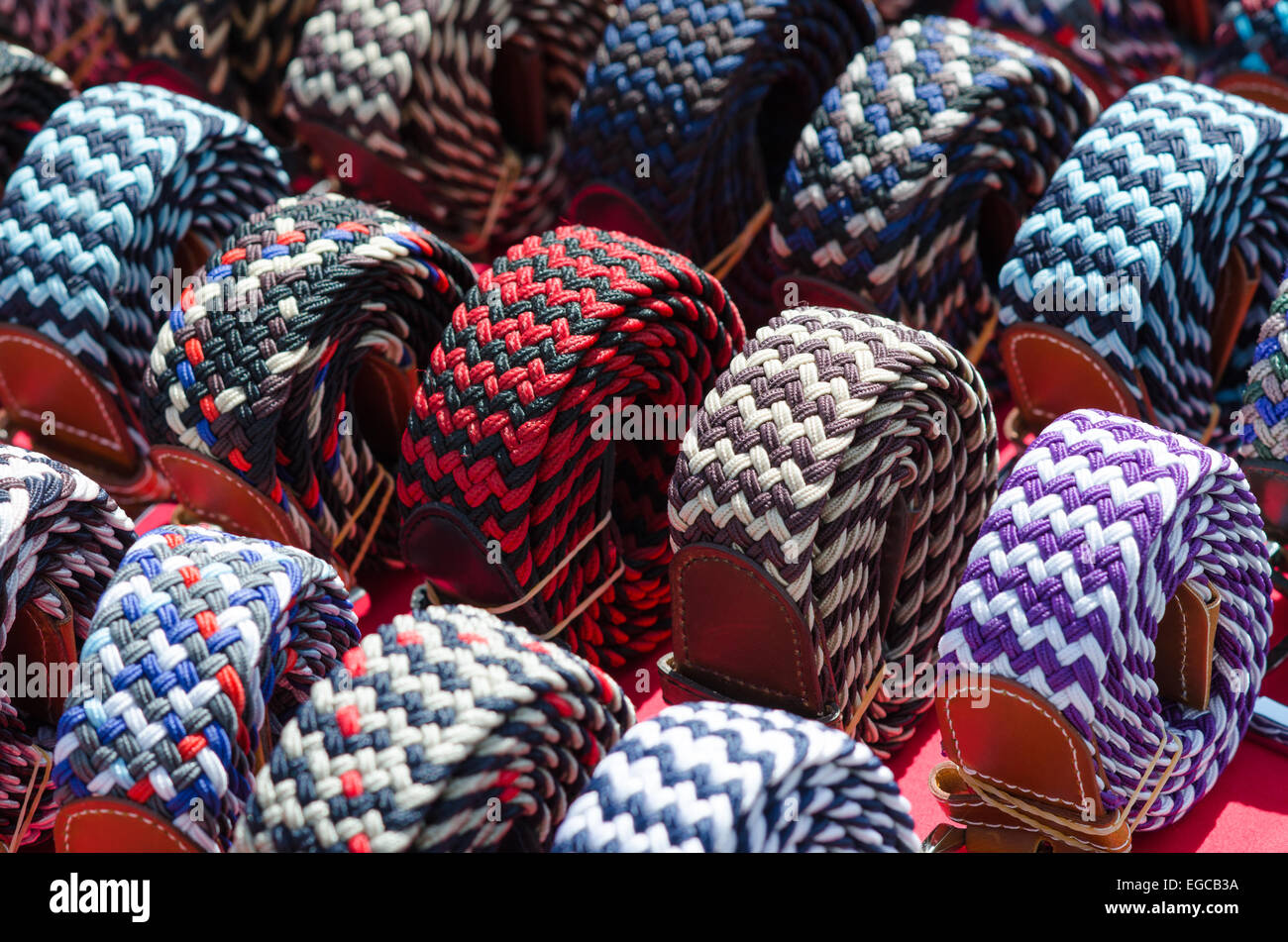 italian style textile waistbands on a desk of a market in Milan Stock Photo
