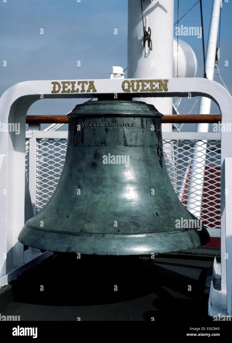 This large ship's bell is outdoors on the upper deck of the Delta Queen, an American paddle-wheel steamboat launched in 1926 and has since become a floating dockside hotel in Chattanooga, Tennessee, USA. The bronze bell was made by Kaye & Co. of Louisville, Kentucky, in 1883 and saw service on several vessels before being installed on the Delta Queen in 1947. Stock Photo