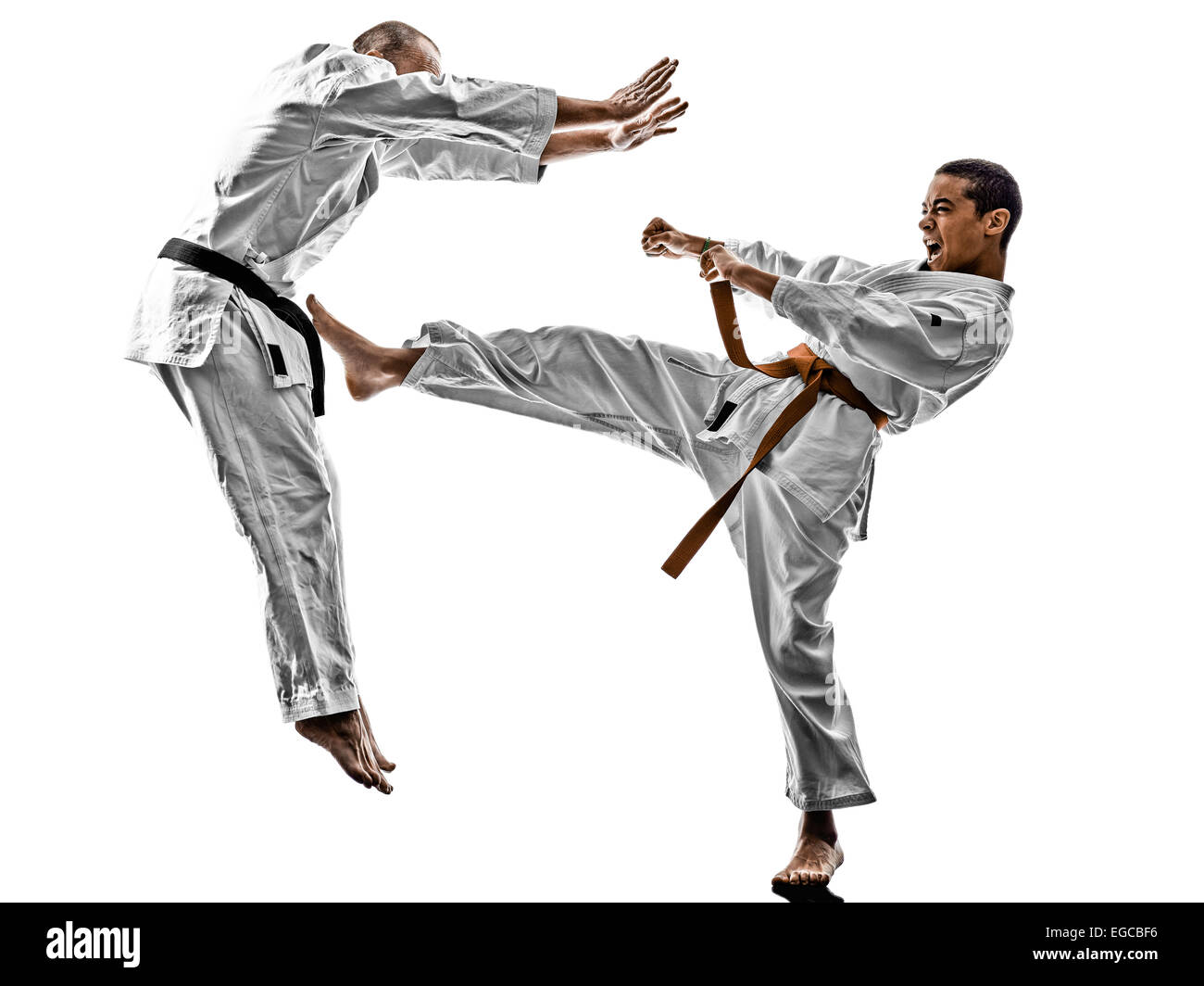 two karate men sensei and teenager student fighters fighting isolated on white background Stock Photo
