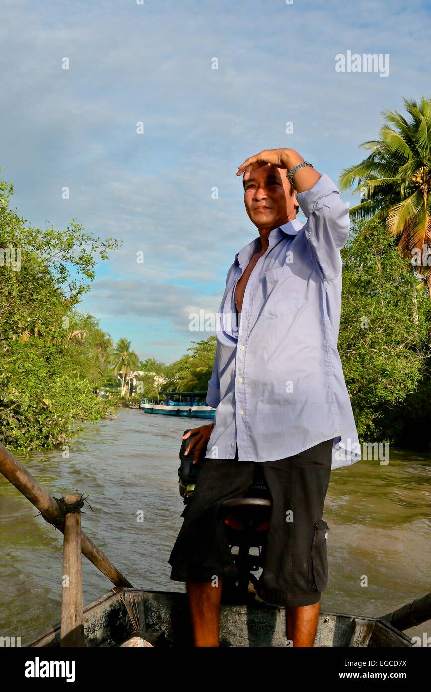 Vietnamese man steering boat hi-res stock photography and images - Alamy