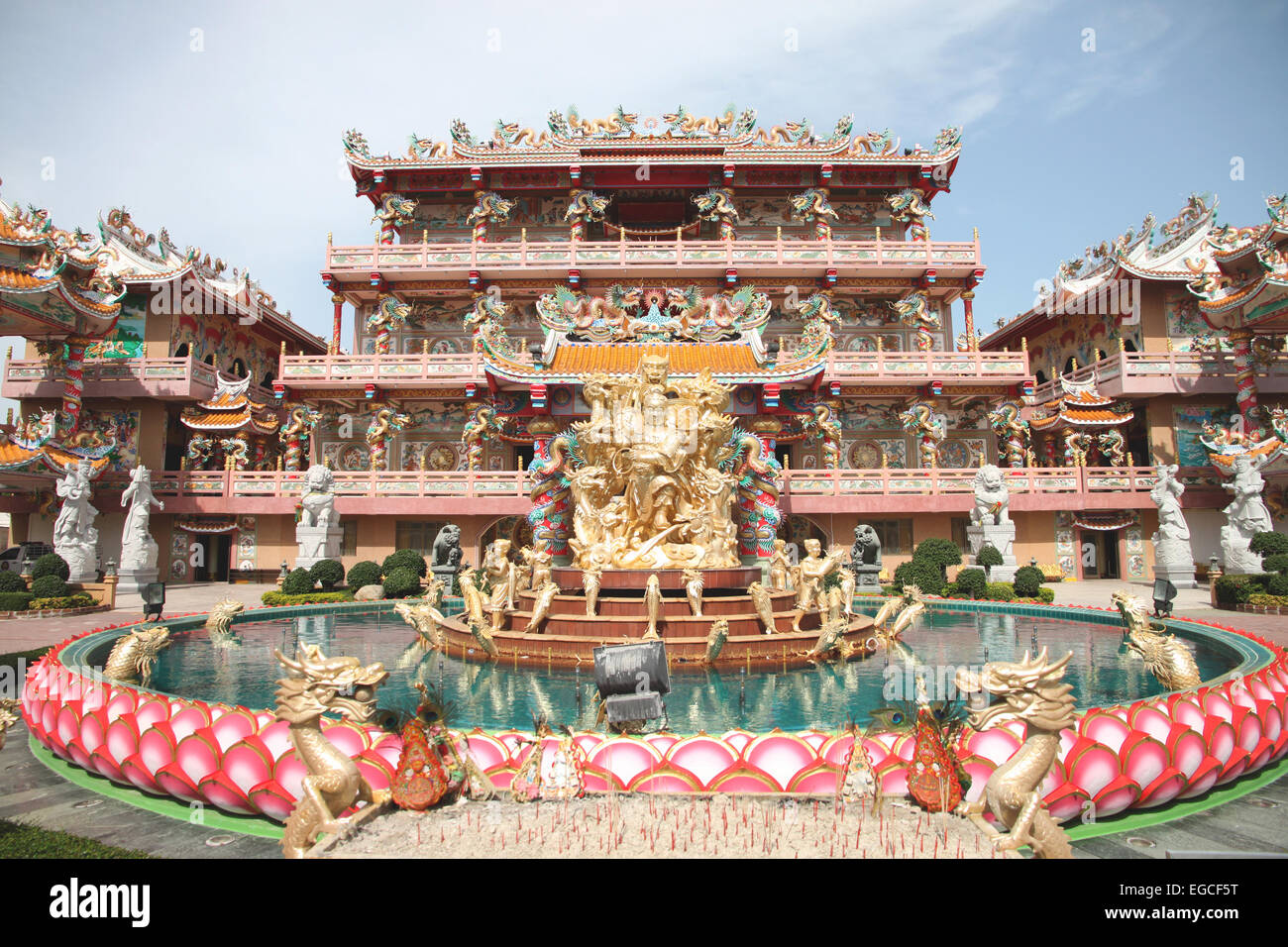 Sculpture in the Chinese Temple on blue sky and white cloud. Stock Photo