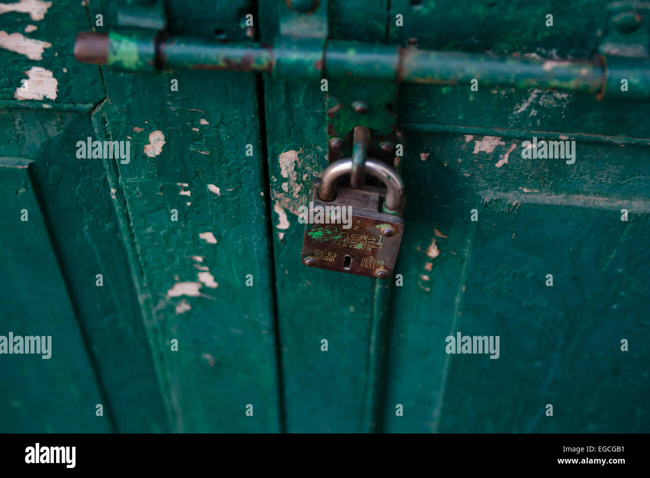 Green Door with padlock Stock Photo