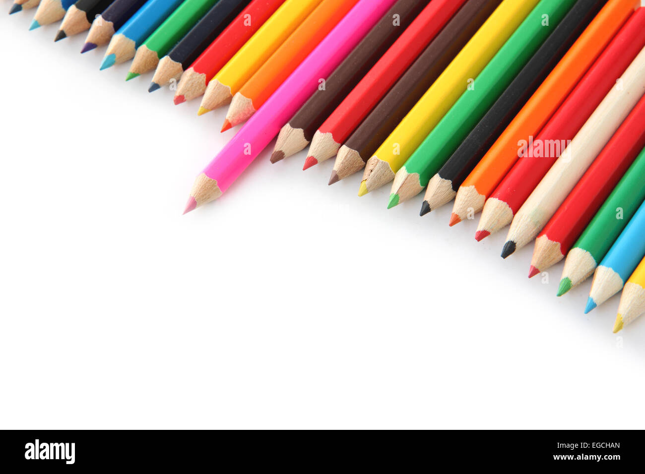 multi colored crayons on a white background. Stock Photo
