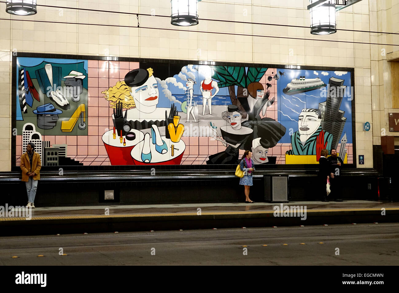 People wait for a bus or light transit train in the Seattle's Westlake ...