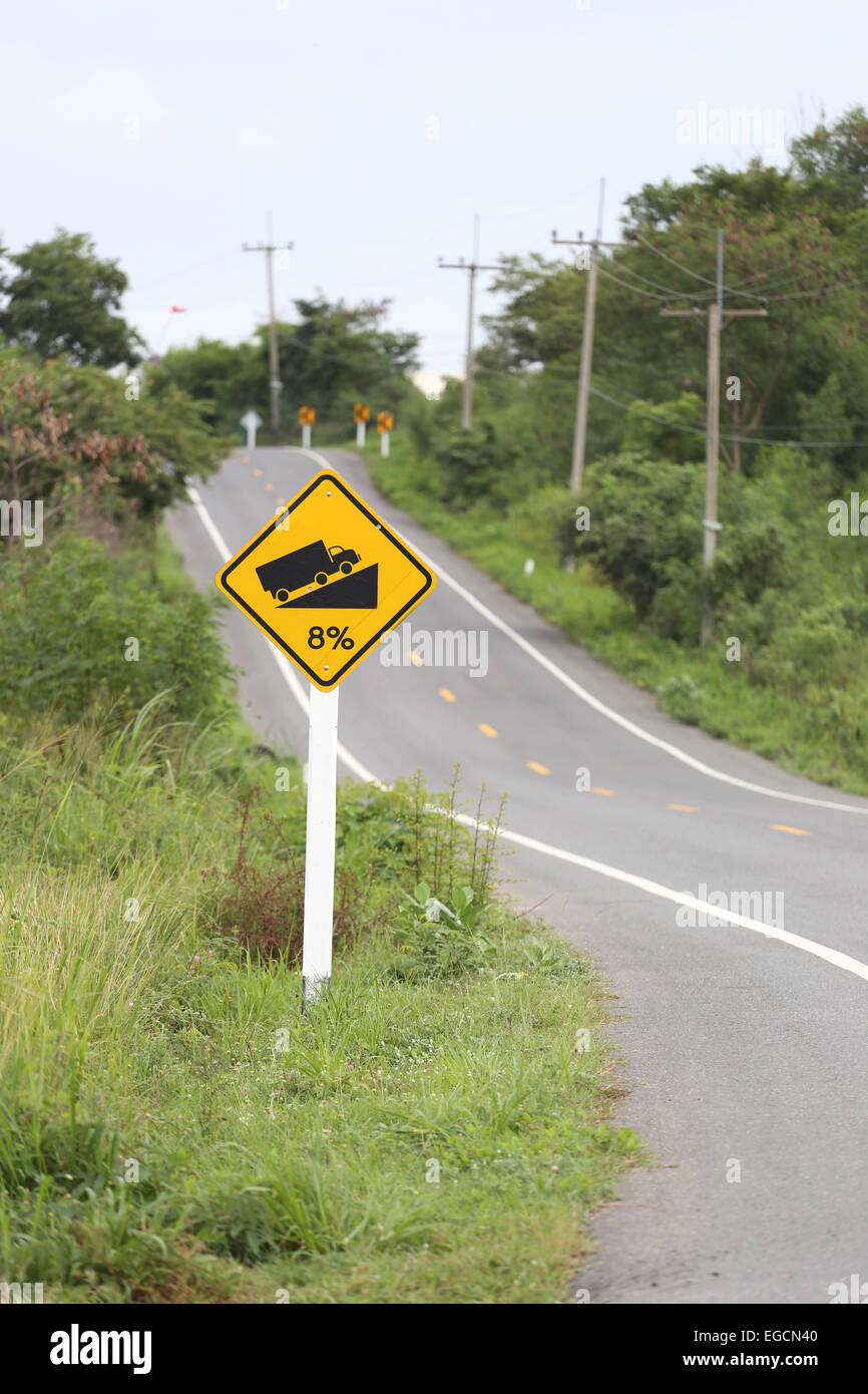 Signposted slope on roadway. Stock Photo