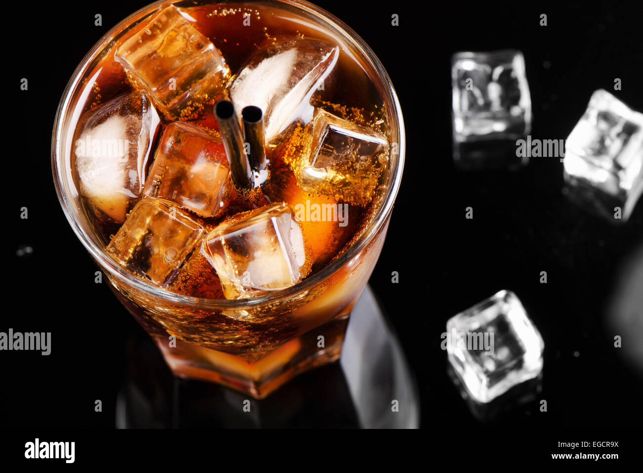 A full glass of cola with ice cubes. Selective focus Stock Photo - Alamy