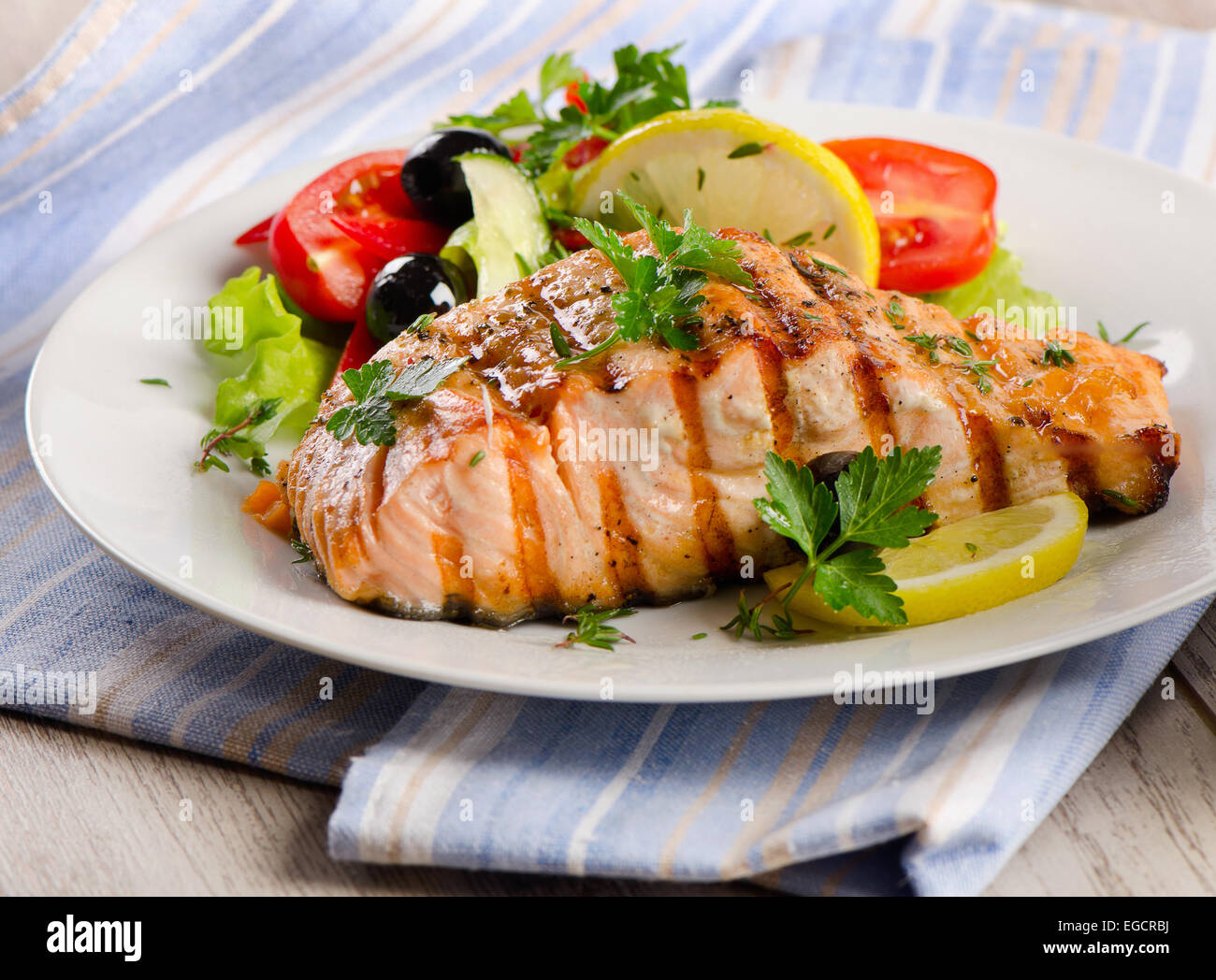 Grilled Salmon with fresh salad. Selective focus Stock Photo