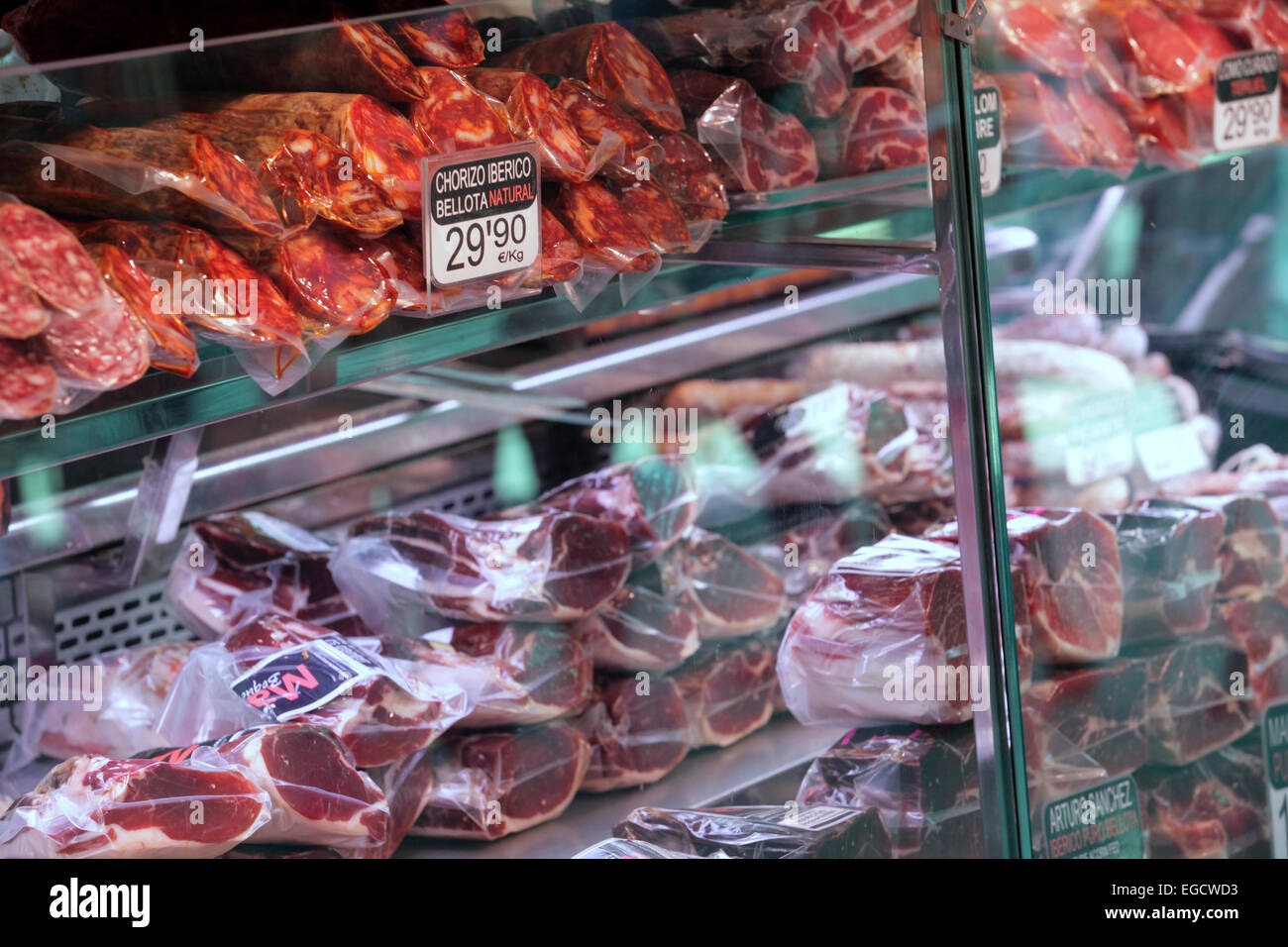Preserved meat, pork sausage, ham and other meat, market stall Barcelona, Spain Stock Photo