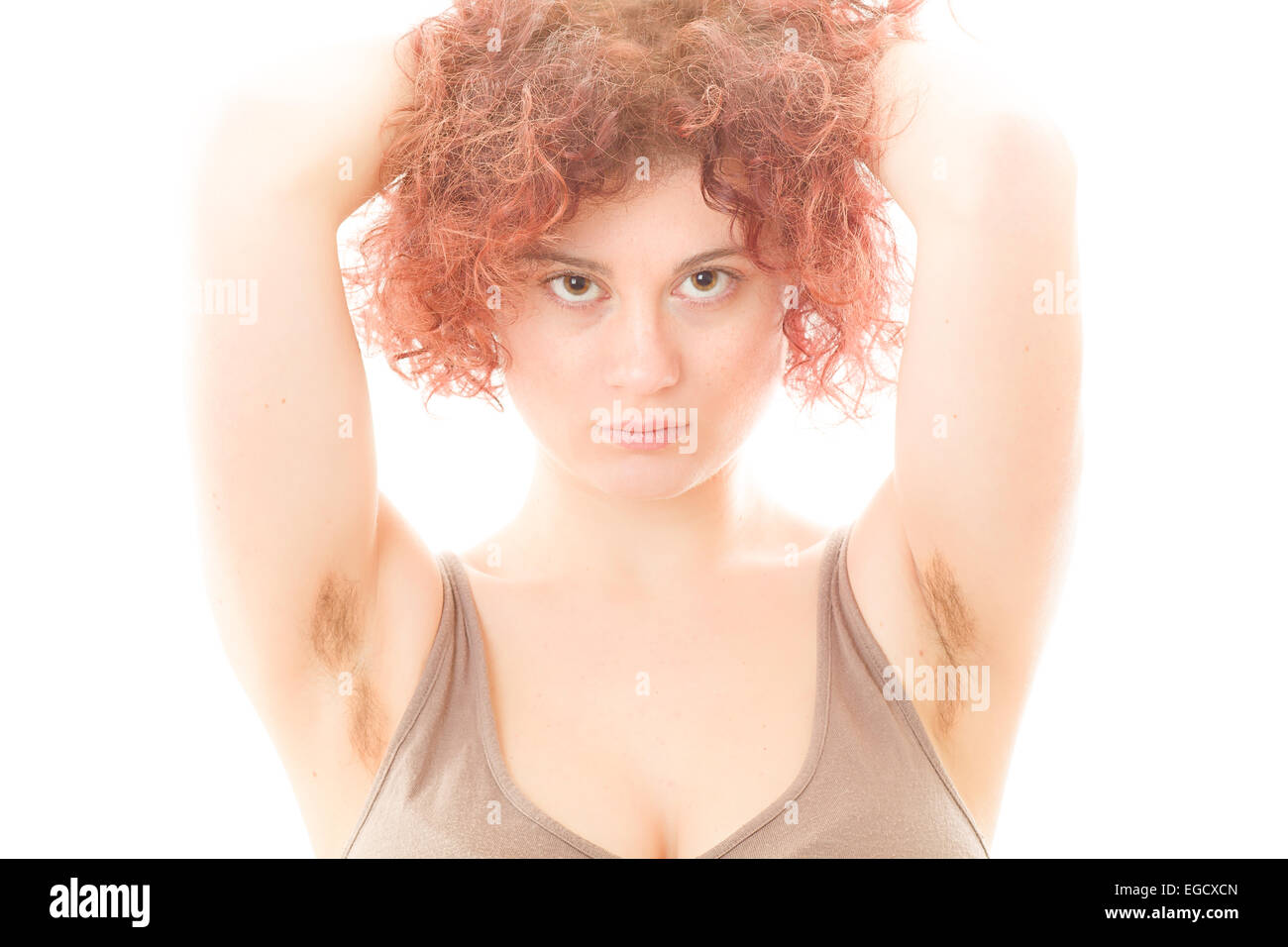 Pretty Woman with Hairy Armpits on White Background Stock Photo