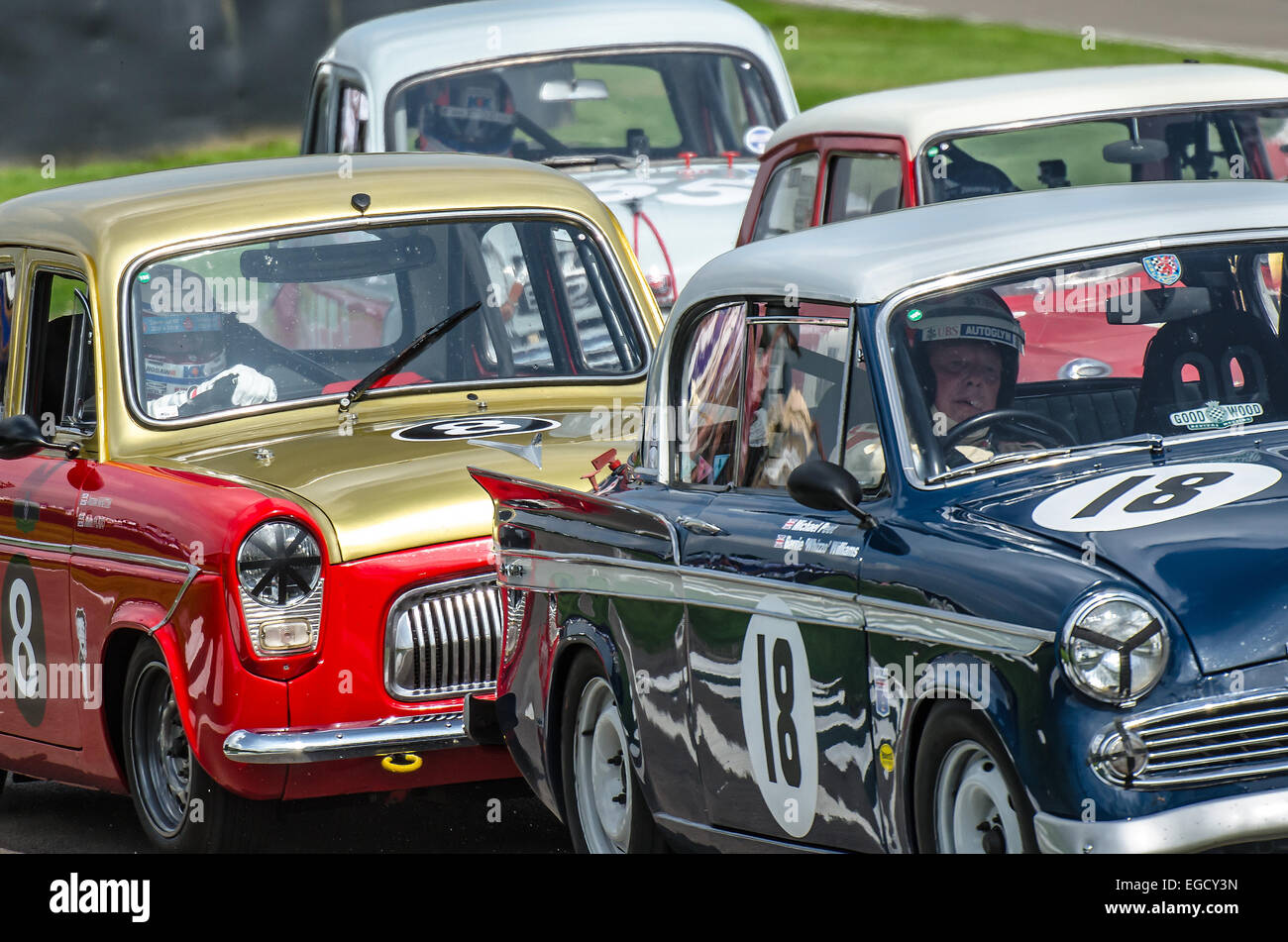 Classic saloon cars racing at the Goodwood Revival. Group of vintage race cars close together Stock Photo