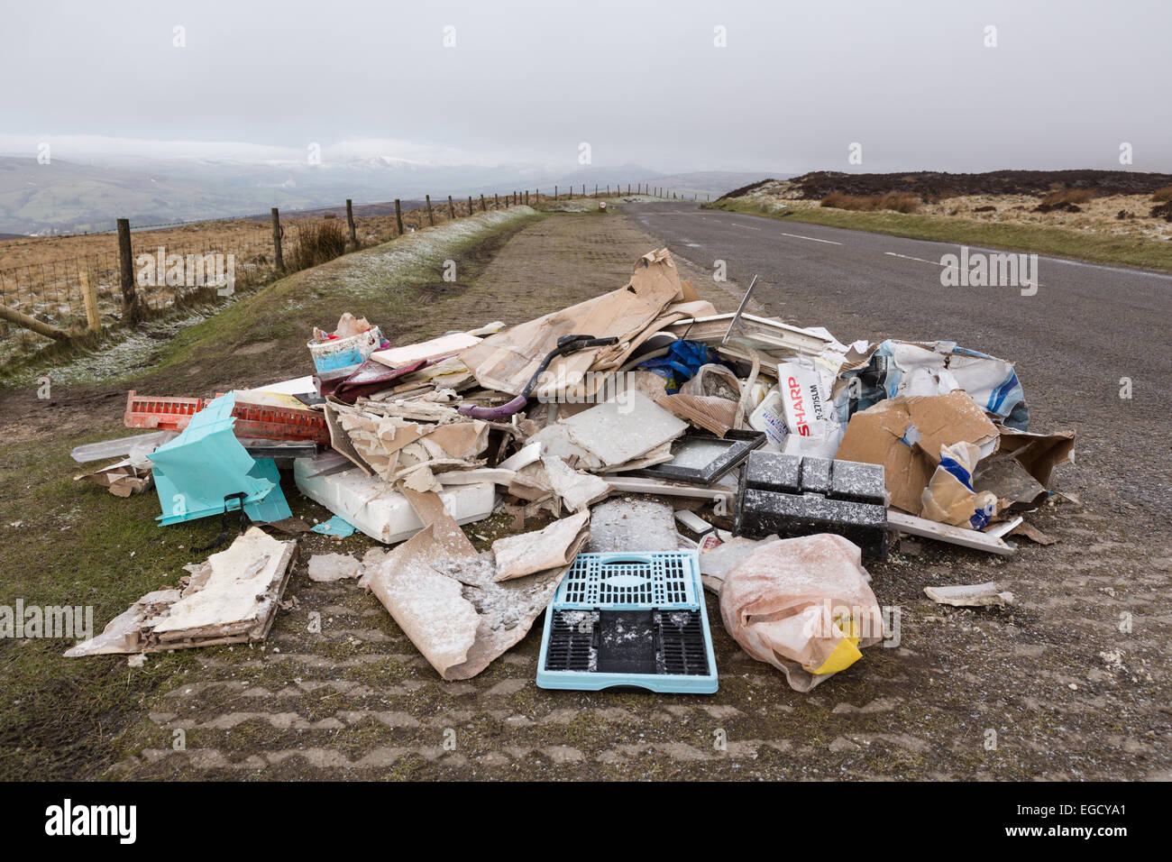 Fly tipping in the Derbyshire countryside, near Stanage Edge in the Peak District. February 2015 Stock Photo