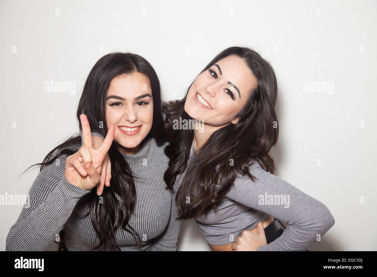 Two sisters close together having fun. Stock Photo