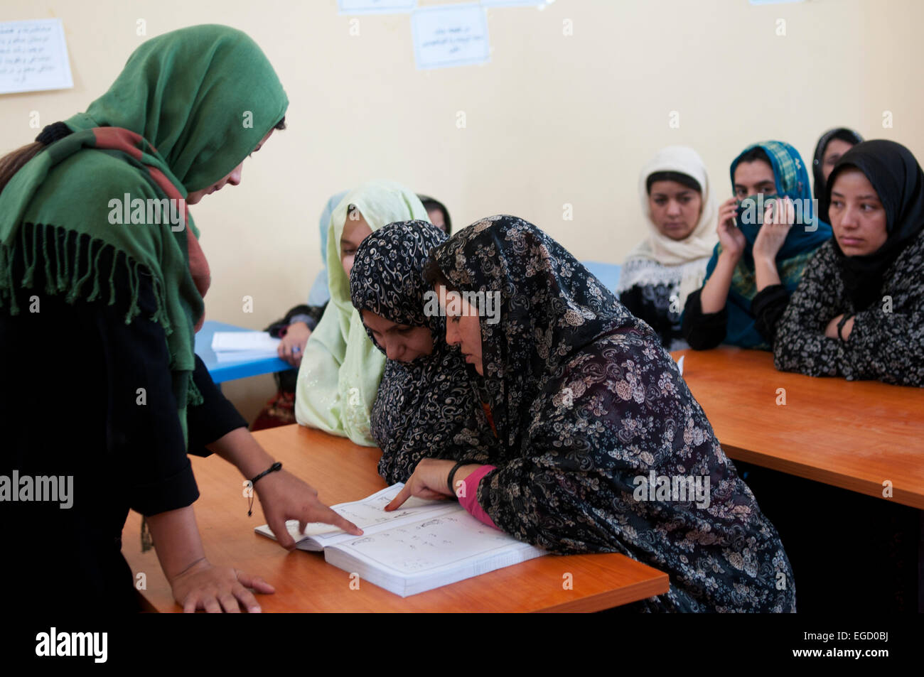 Herat Women's prison - classroom. Women learn to read Stock Photo