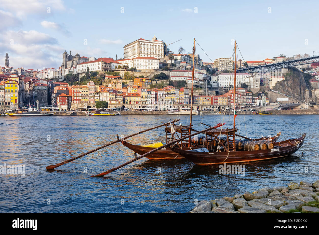 Porto, Portugal. Rabelo Boats, the iconic Port Wine transports, in the Douro river and Ribeira District at back. World Heritage. Stock Photo