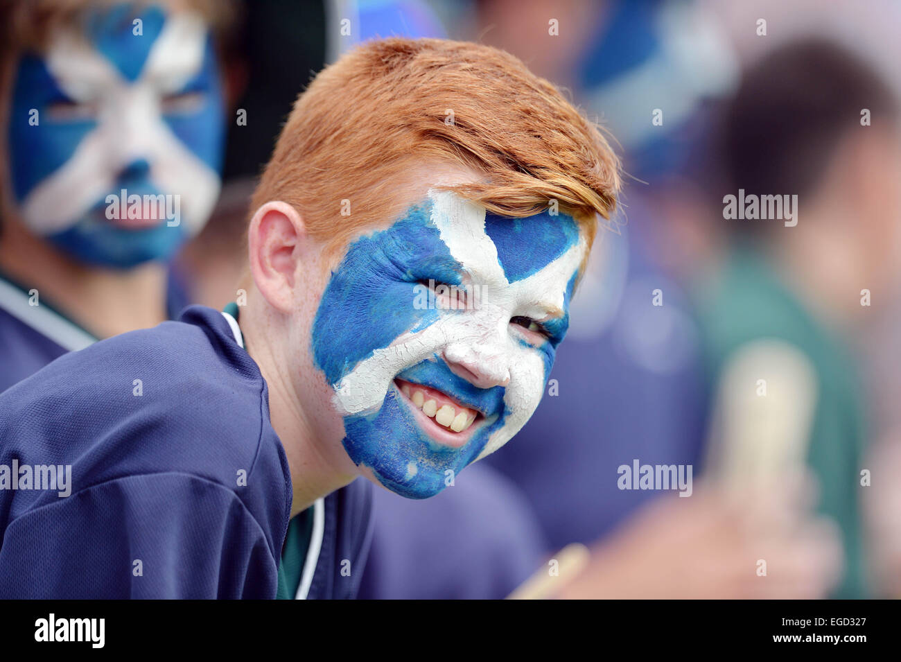 Christchurch, New Zealand, Feature, Highlight. 23rd Feb, 2015. Christchurch, New Zealand - February 23, 2015 - A young scottish fan shows his support by having the Saint Andrew's Cross, flag of Scotland, painted at his face during the ICC Cricket World Cup Match between England and Scotland at Hagley Oval on February 23, 2015 in Christchurch, New Zealand, Feature, Highlight. Credit:  dpa/Alamy Live News Stock Photo
