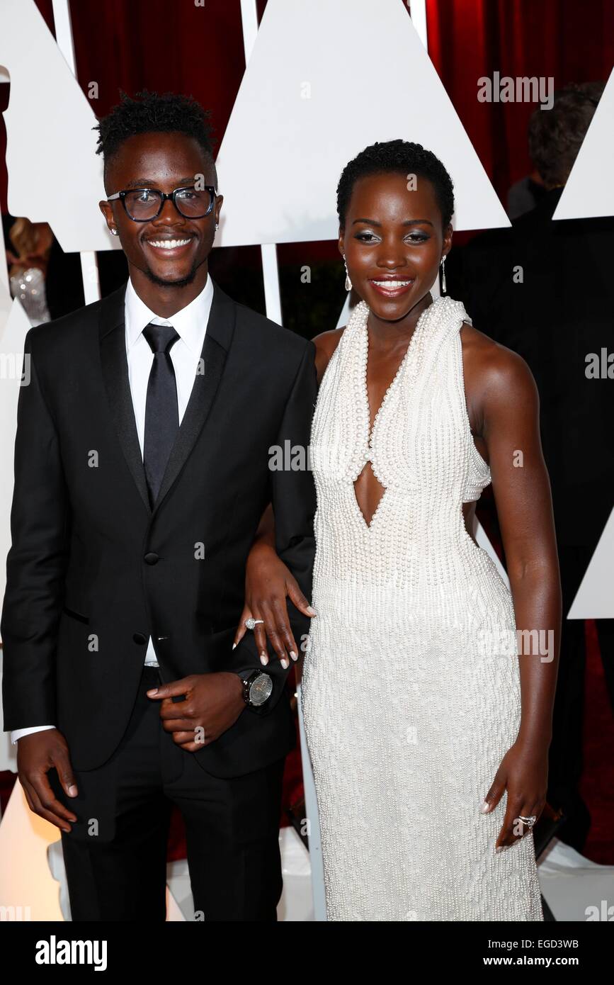 Actress Lupita Nyong'o and husband Peter Nyong'o attend the 87th