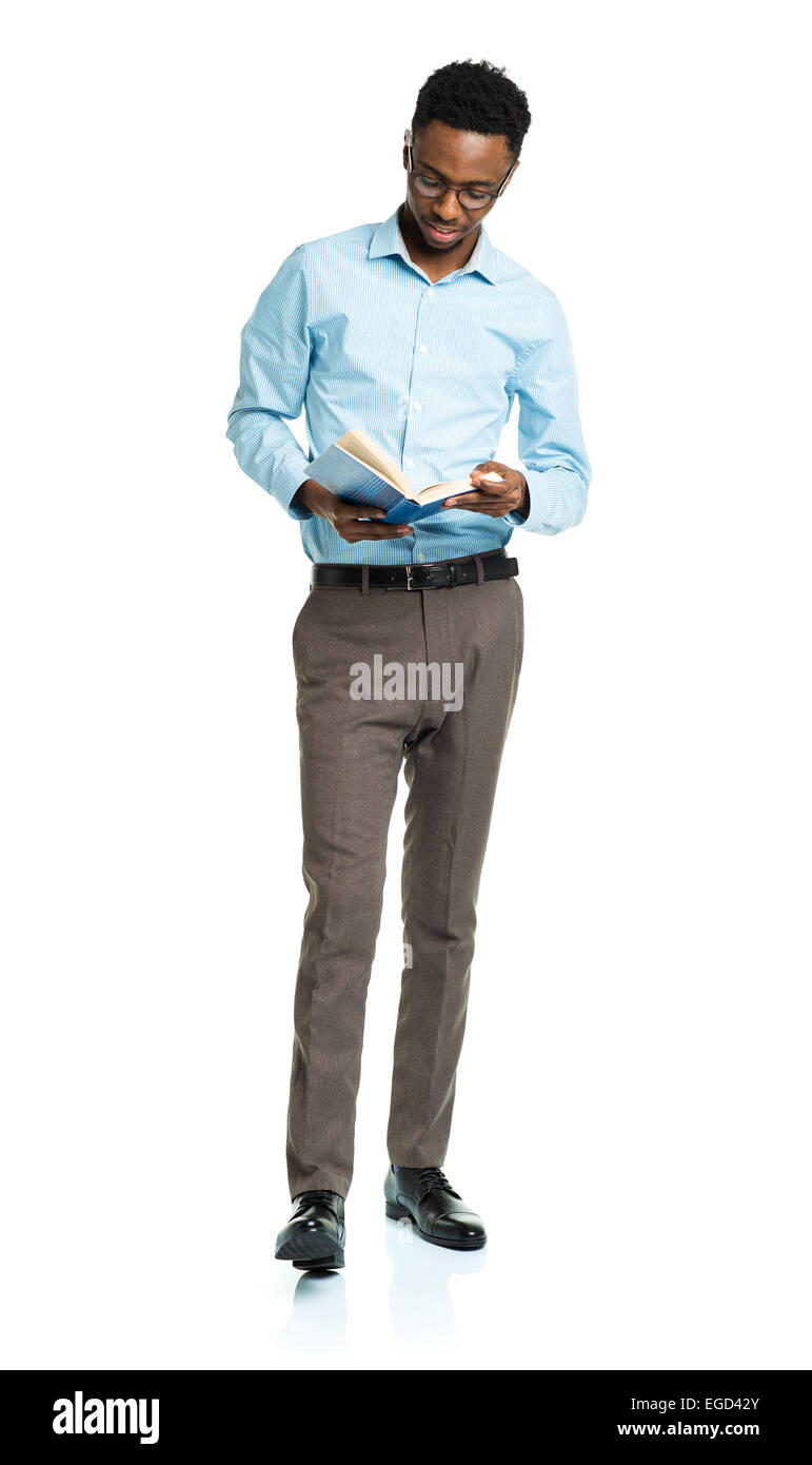 Happy african american college student with books in his hands  standing on white background Stock Photo