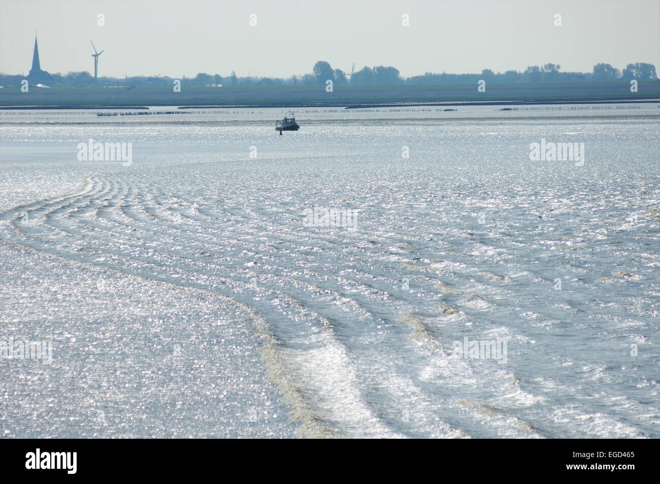 Under water sandbanks in the Waddensea made visible by tidal waters and the waves that occur when they hit shallow waters Stock Photo