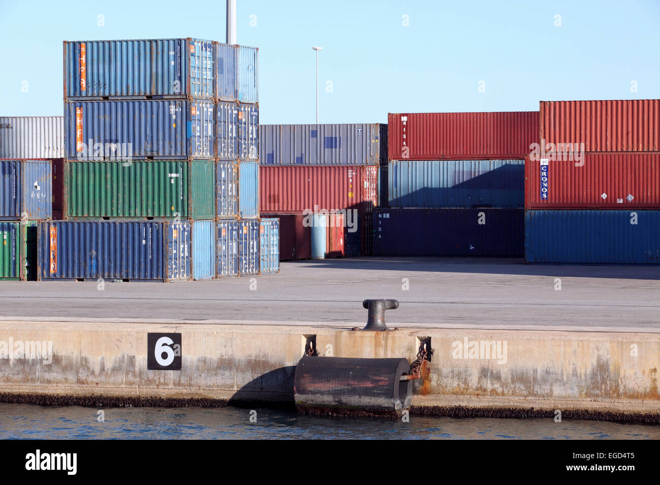 Contrasting and colorful stacks of shipping containers piled-up at Barcelona docks. Stock Photo