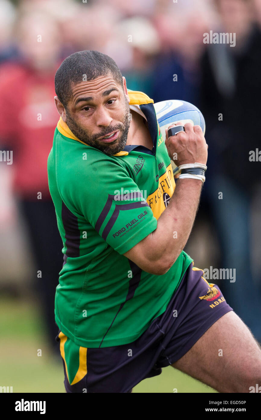 Rugby player in action running with the ball. Stock Photo