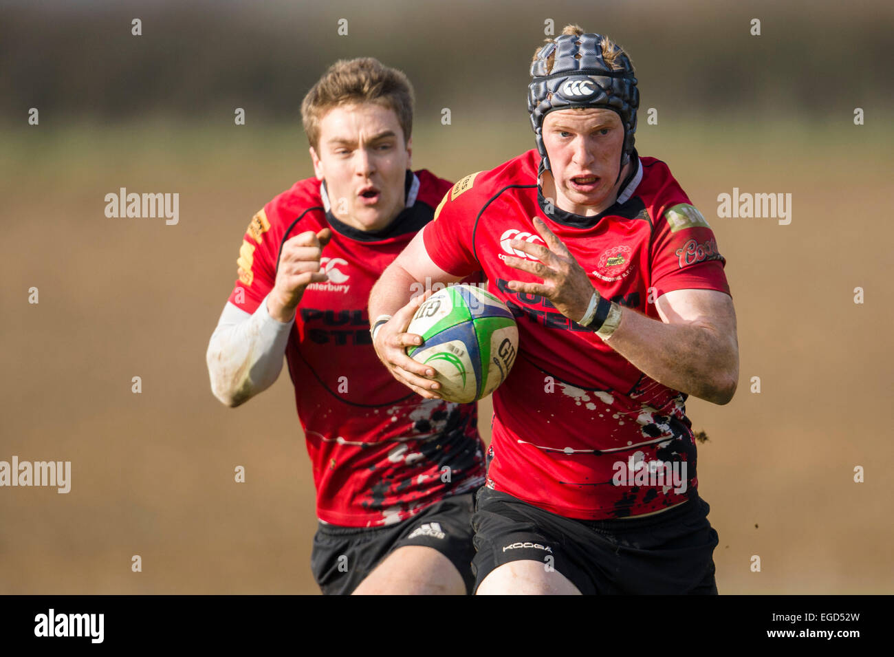 Rugby player in action running with the ball. Stock Photo