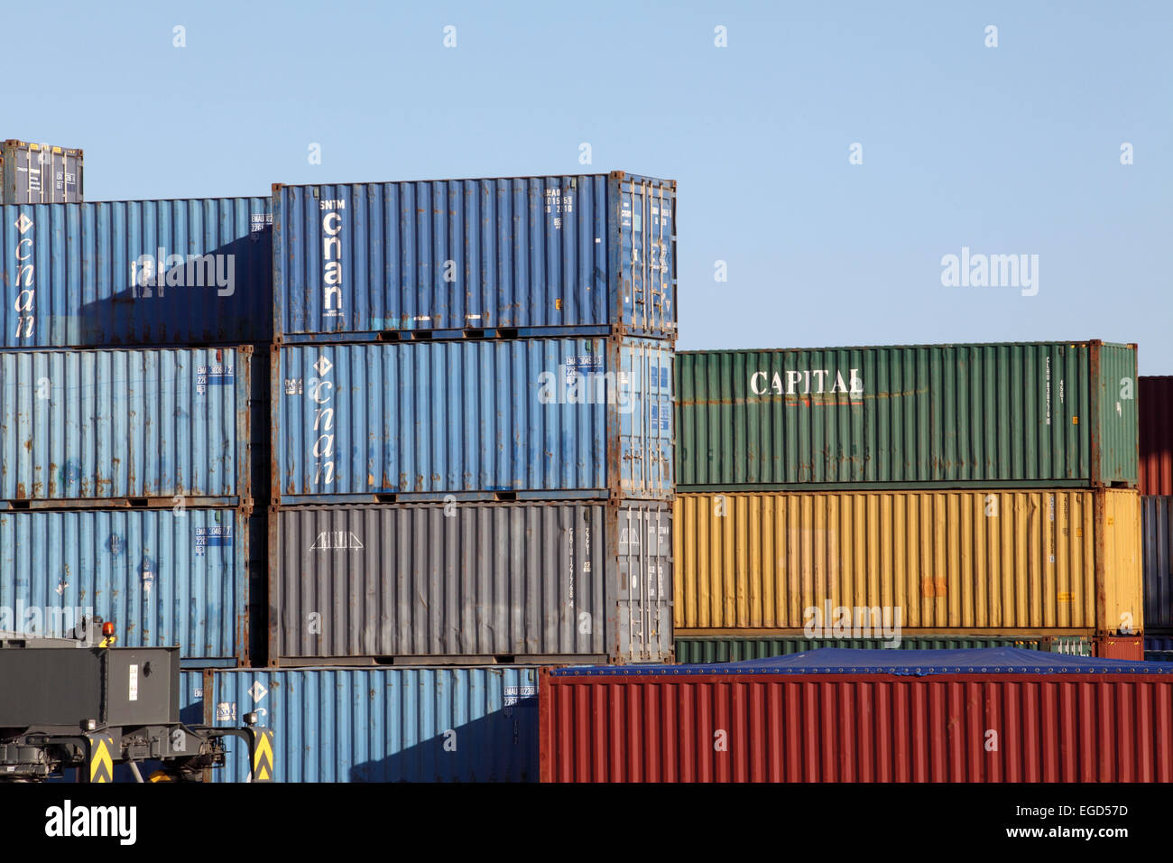 Contrasting and colorful stacks of shipping containers piled-up at Barcelona docks. Stock Photo