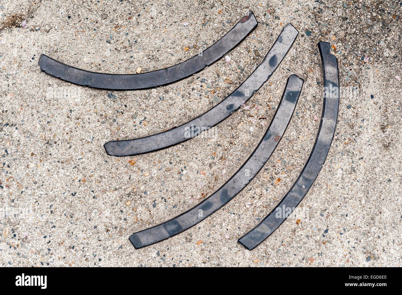 A pattern of curved roof tiles set into a path in Shosei-en garden, central Kyoto, Japan Stock Photo