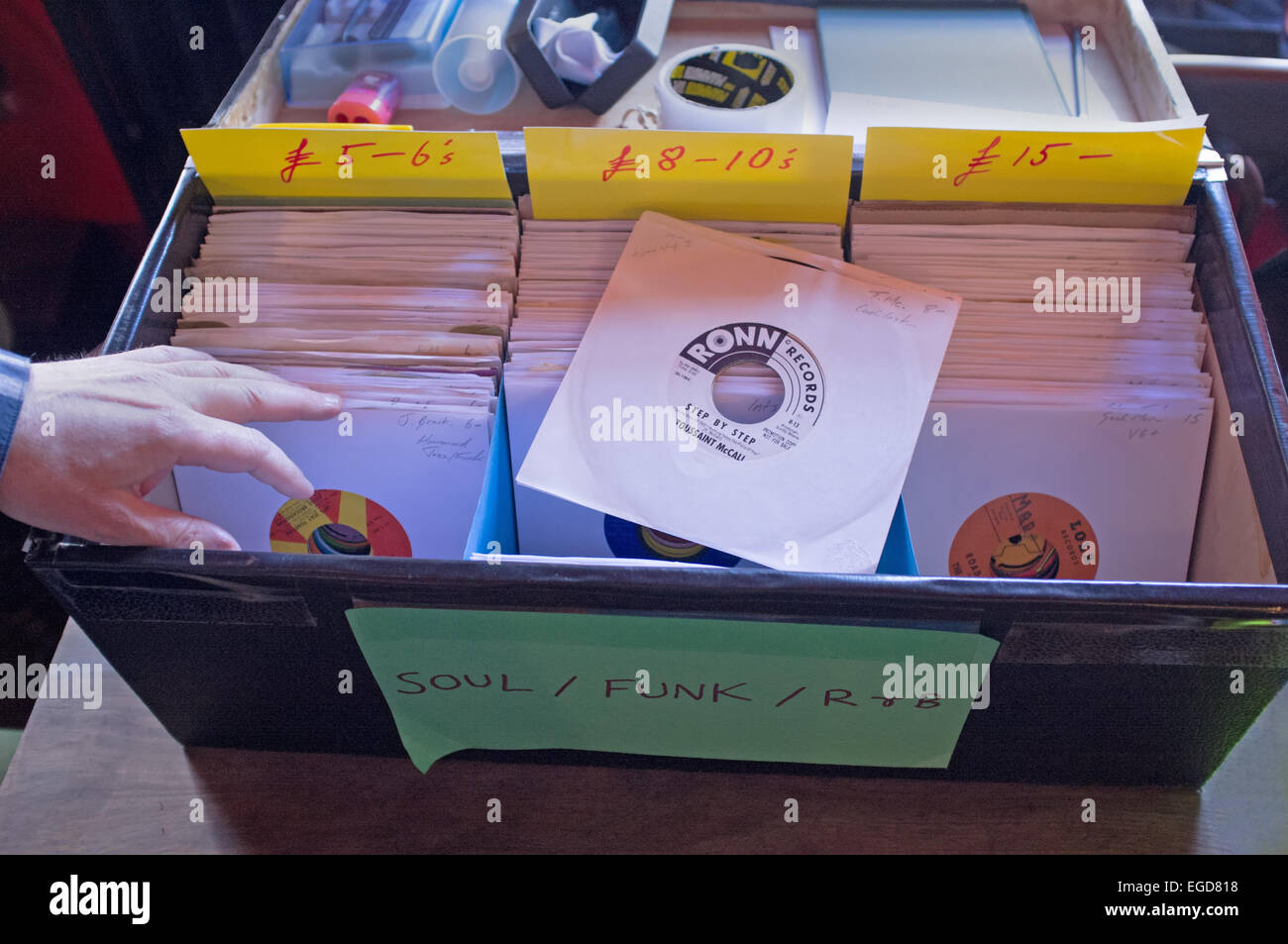 Sorting through second-hand records at a record fair. Stock Photo