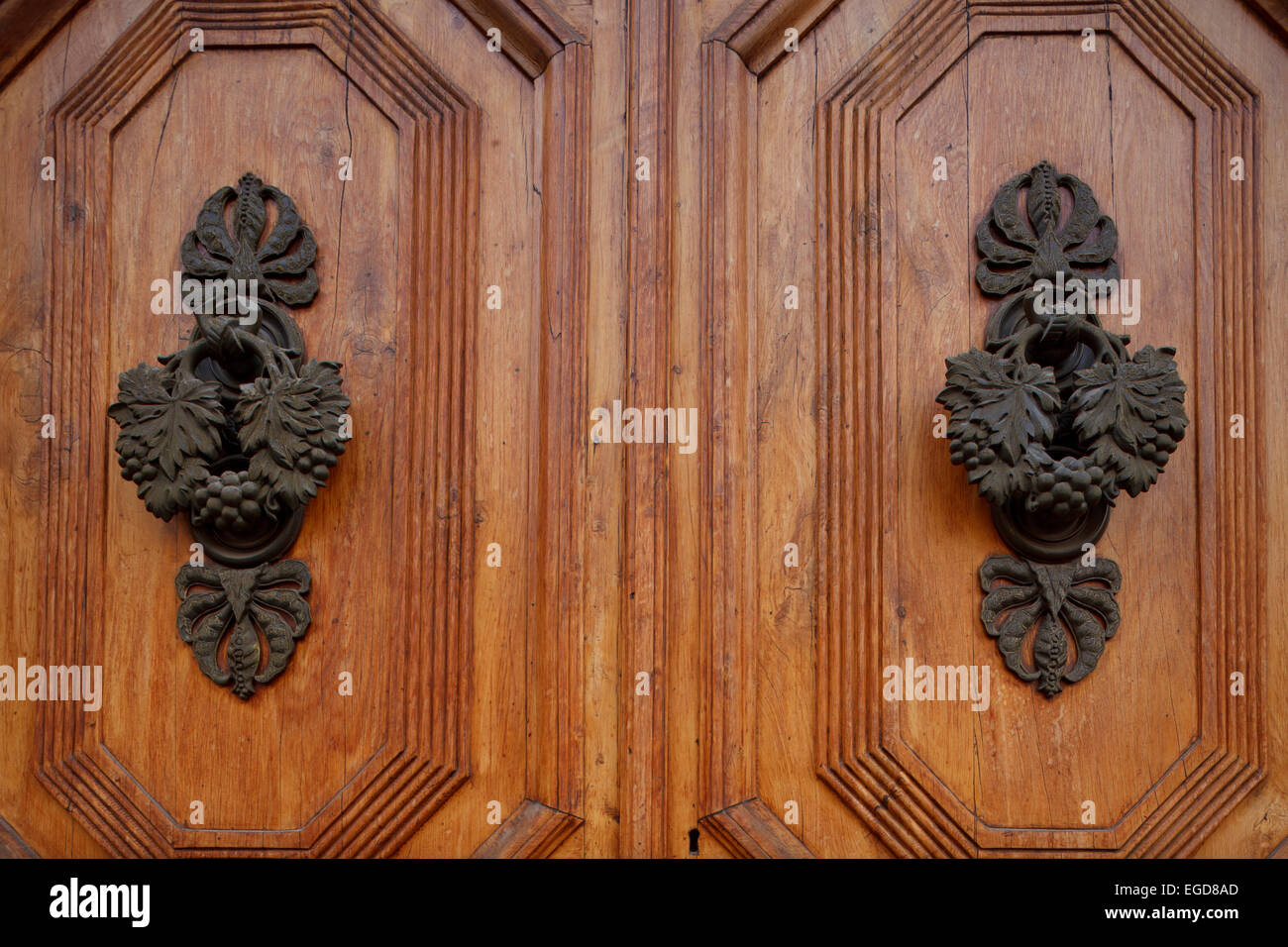 Door knocker in the shape of grape vines, door, Pistoia, Via Francigena, Tuscany, Italy, Europe Stock Photo