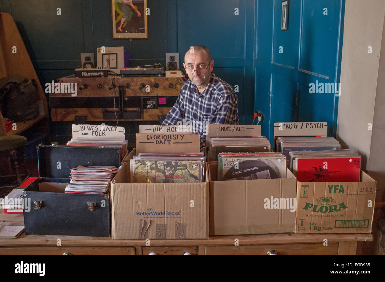 A record dealer with his stock at a record fair. Stock Photo