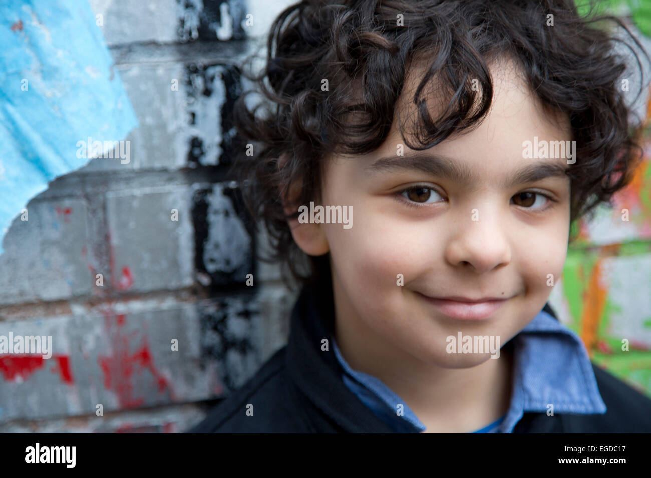 7 year old boy hanging out in Brick Lane East London Stock Photo