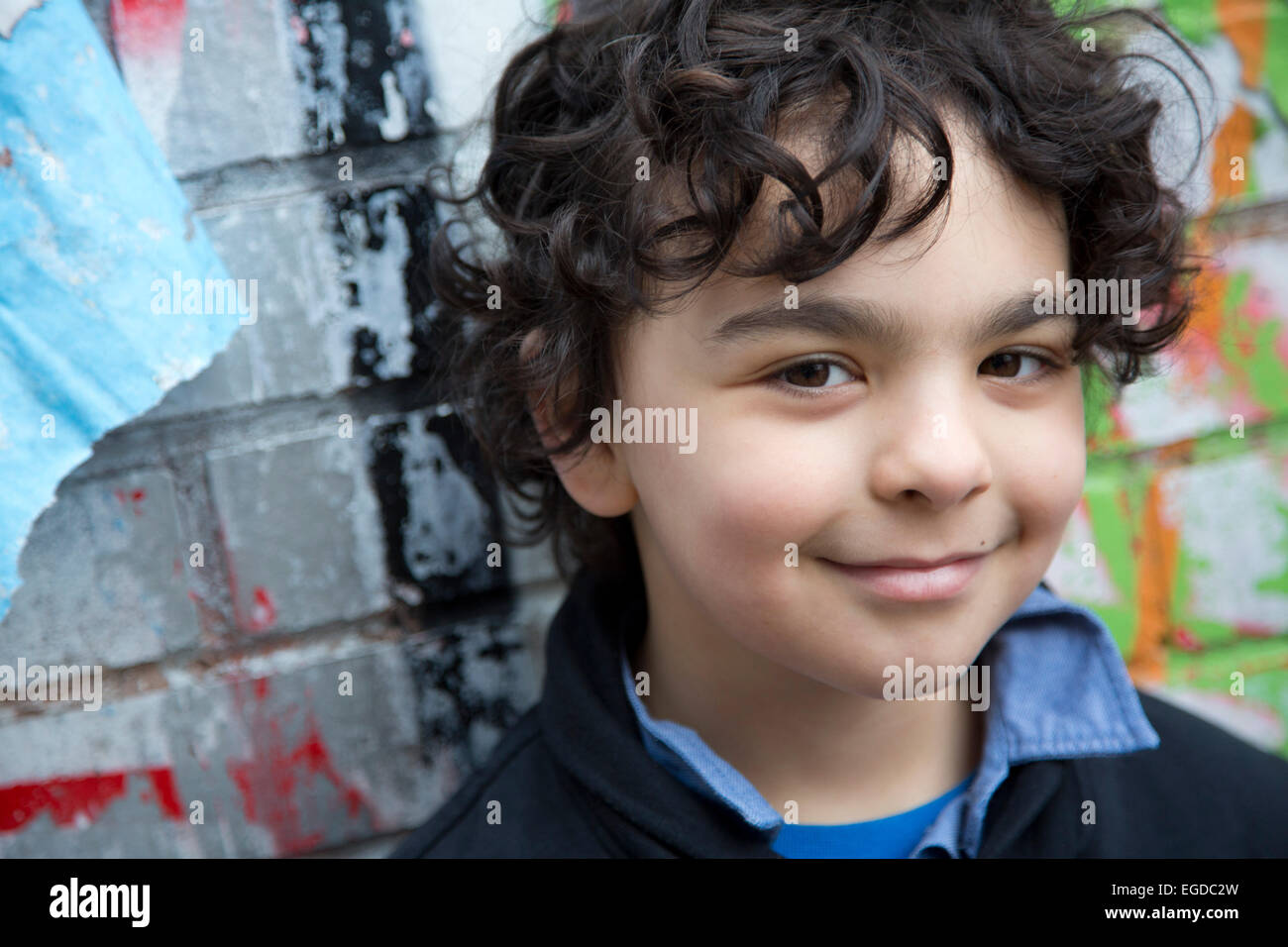 7 year old boy hanging out in Brick Lane East London Stock Photo