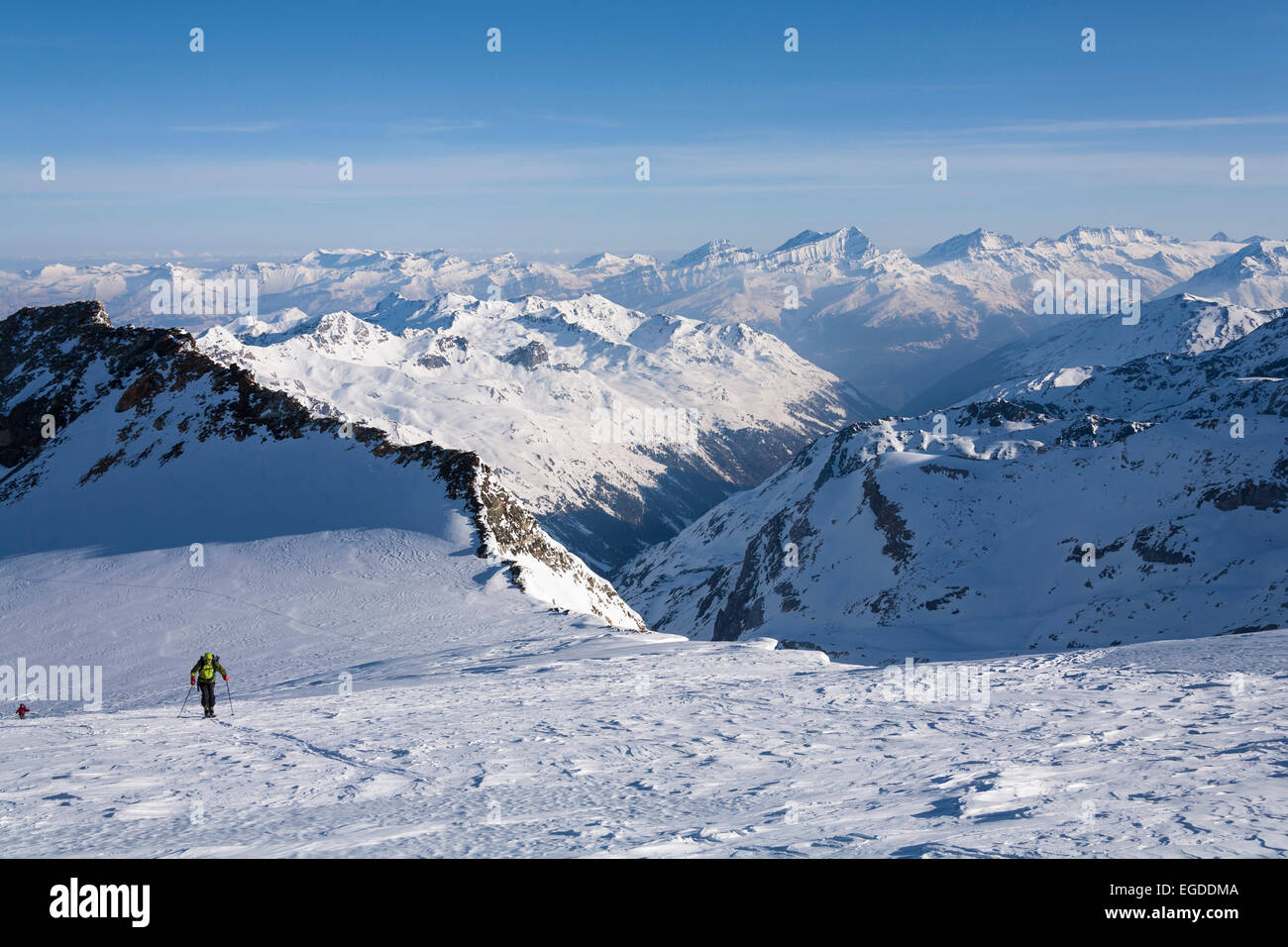 Skier ascending over Turtmann glacier to mount Bishorn, Turtmann valley ...