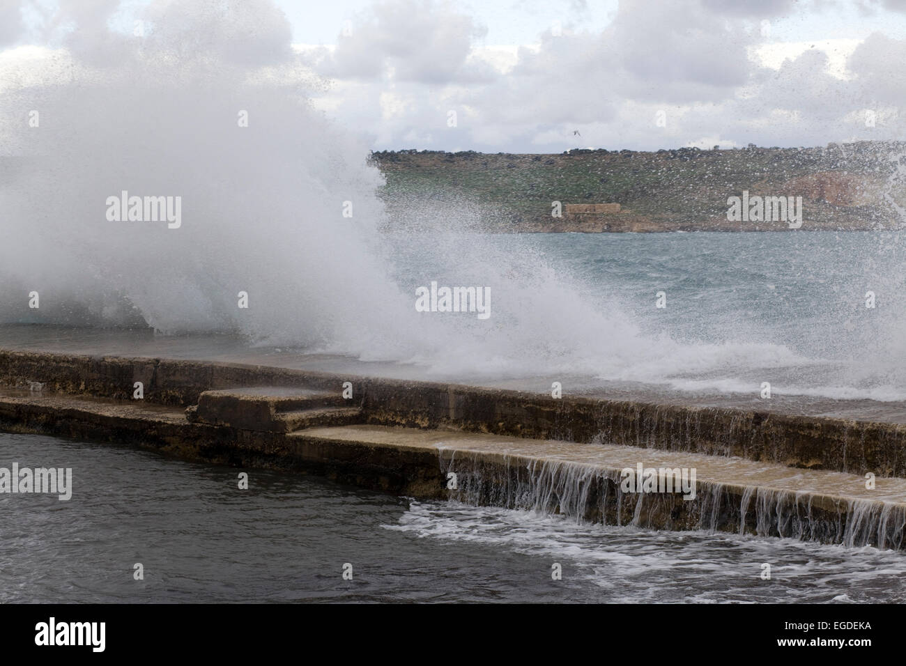 Seas Battering the sea wall in Malta Stock Photo