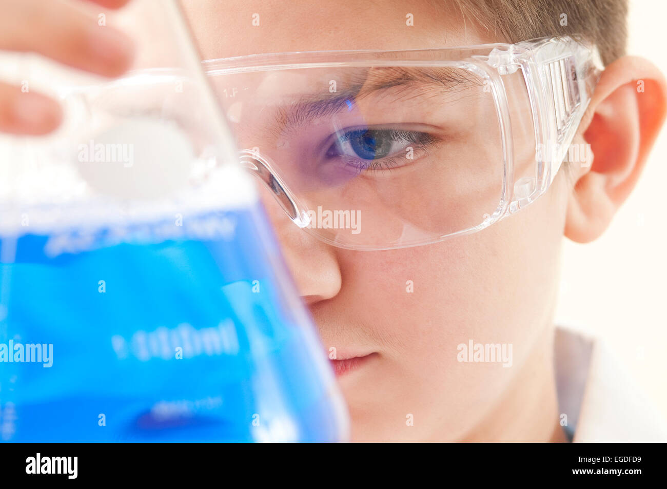 teenage school boy in chemistry lesson Stock Photo