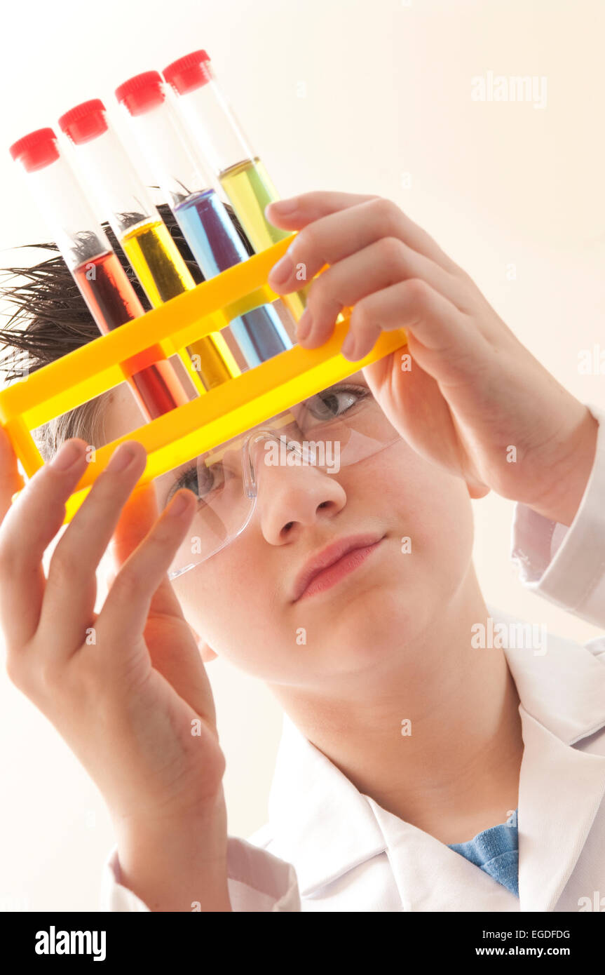 teenage school boy in chemistry lesson Stock Photo