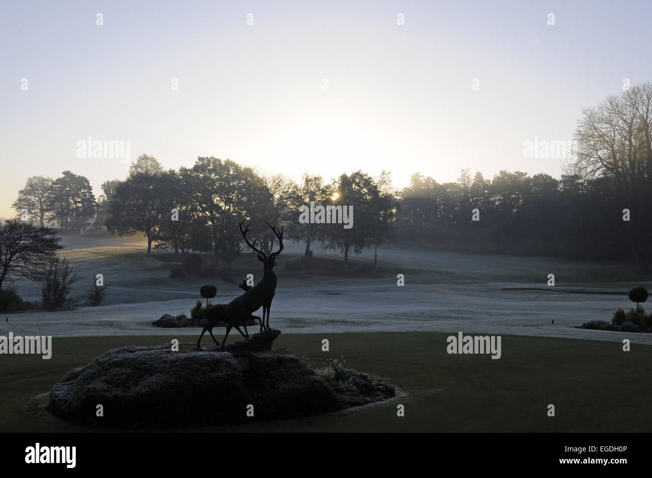 View on a frosty morning over Putting Green with Stag Statue towards 1st and 18th Holes Porters Park Golf Club Radlett Stock Photo