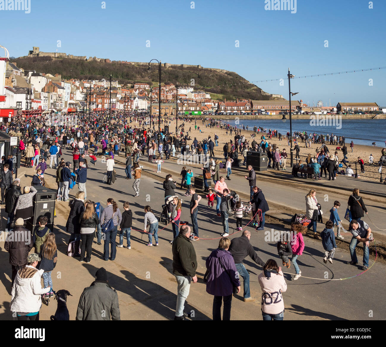 Traditional Shrove Tuesday skipping custom on the foreshore Scarborough Yorkshire UK Stock Photo