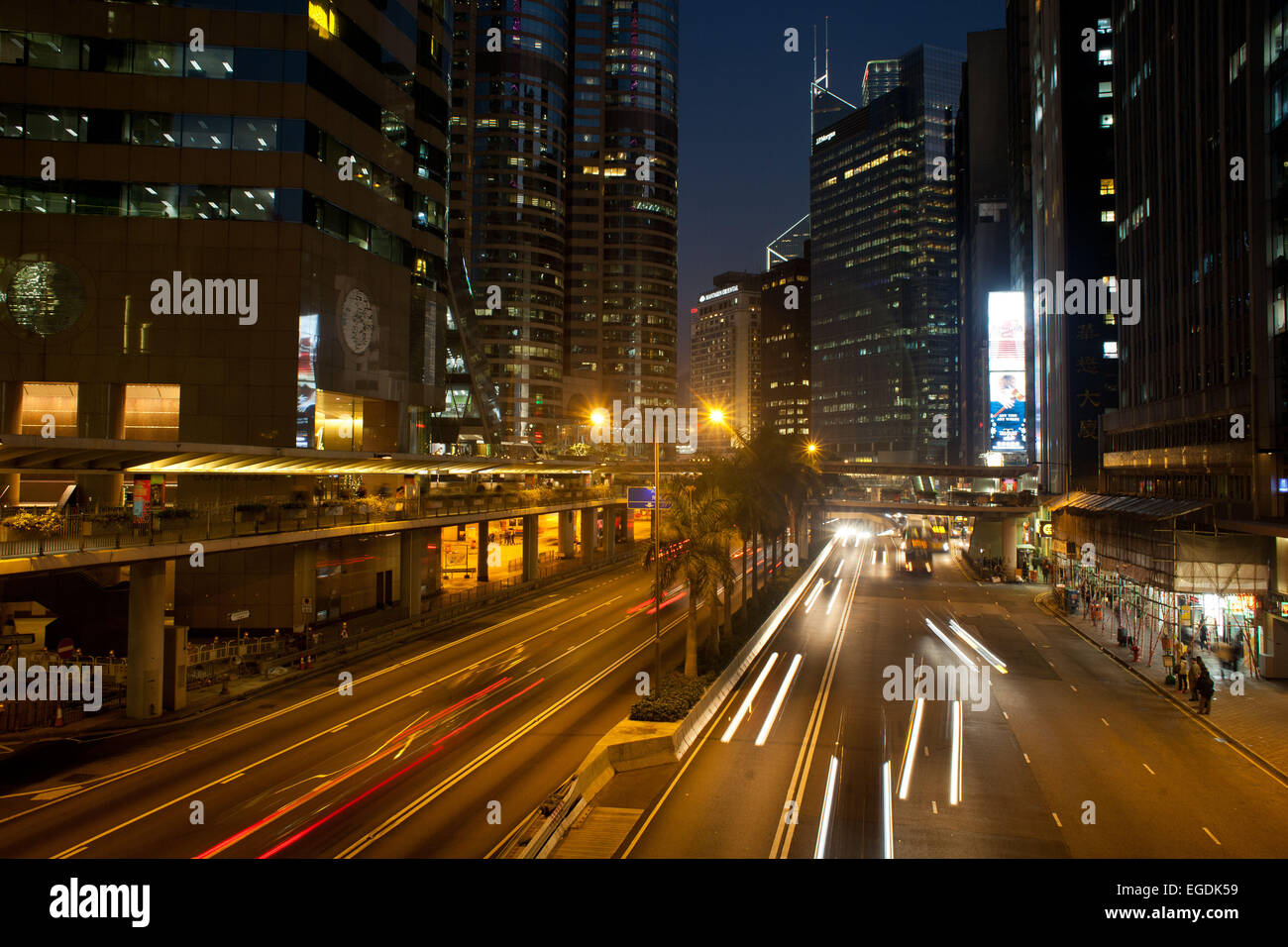 Connaught Street in Central Hong Kong with night time traffic shot at long exposure. 7 million people live on 1,104km square, ma Stock Photo